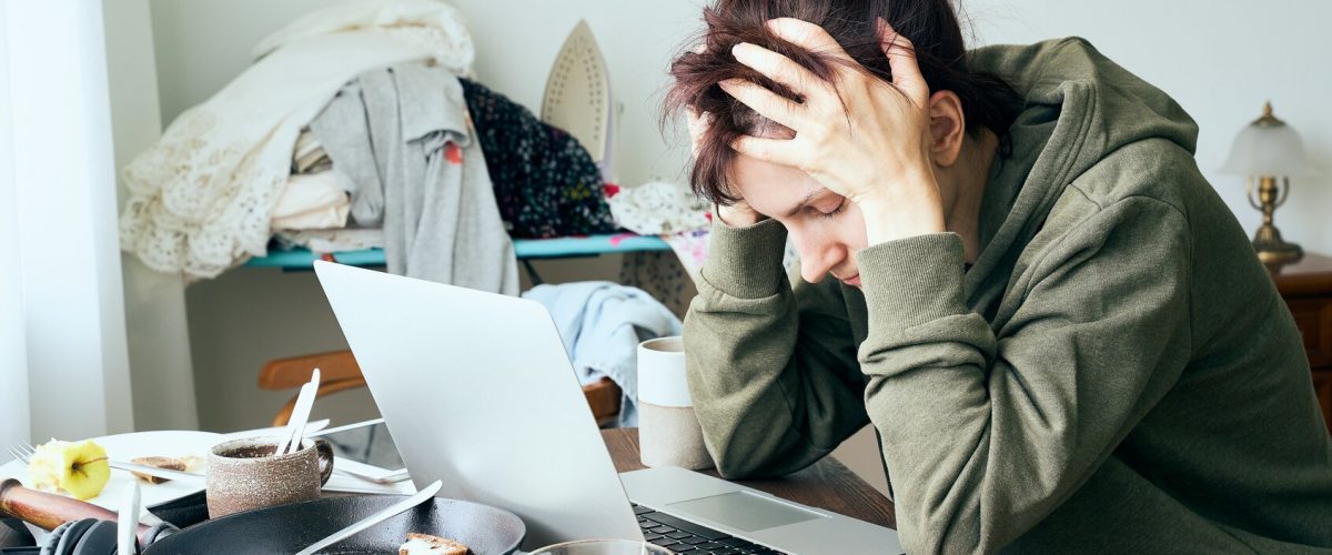 Digital addiction, woman in panic and stress, abandoned household chores, apartment is mess and dirt. Information attack, infodemic